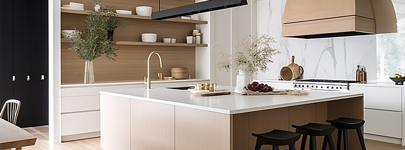 A minimalist L-shaped kitchen with a large kitchen island and chairs placed underneath.