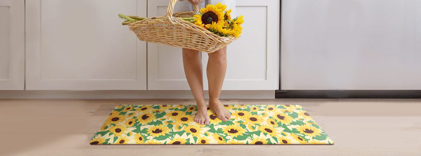 Matace kitchen rugs are laid out in the farmhouse style kitchen, and a beautiful woman is holding sunflowers standing on the kitchen mat.
