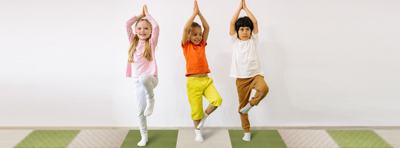 A group of children stood on olive and cream Matace carpet squares in the classroom