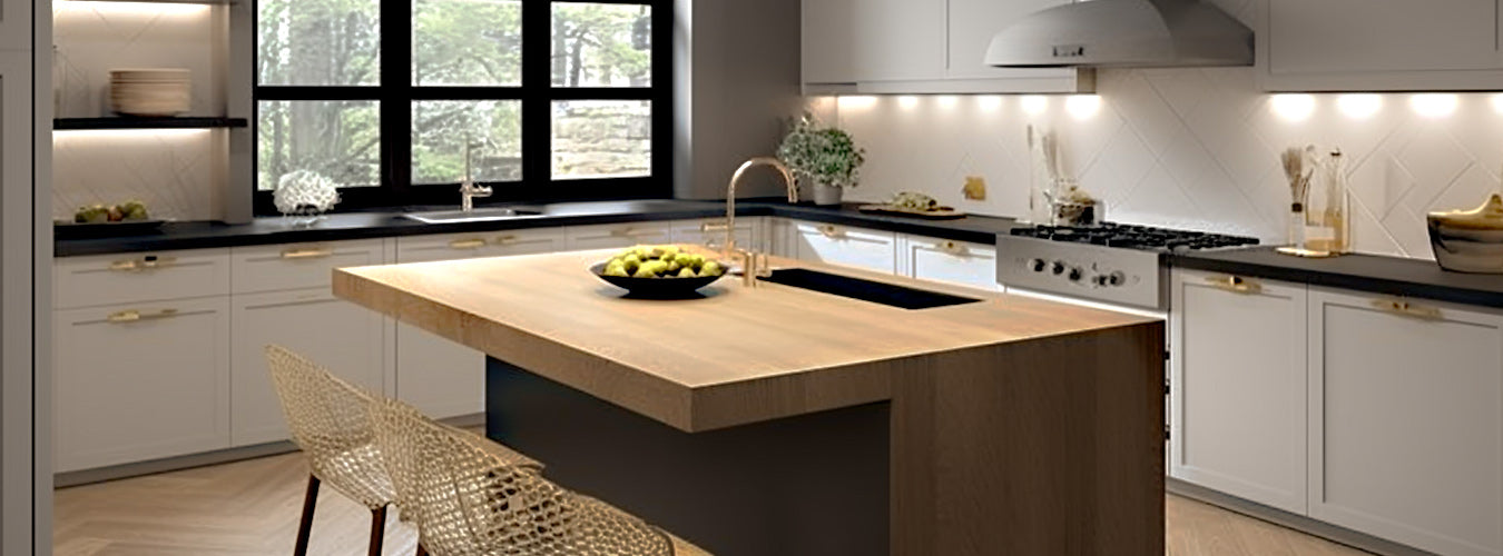 A modern L-shaped large kitchen with some fruit and cutlery looks comfortable.